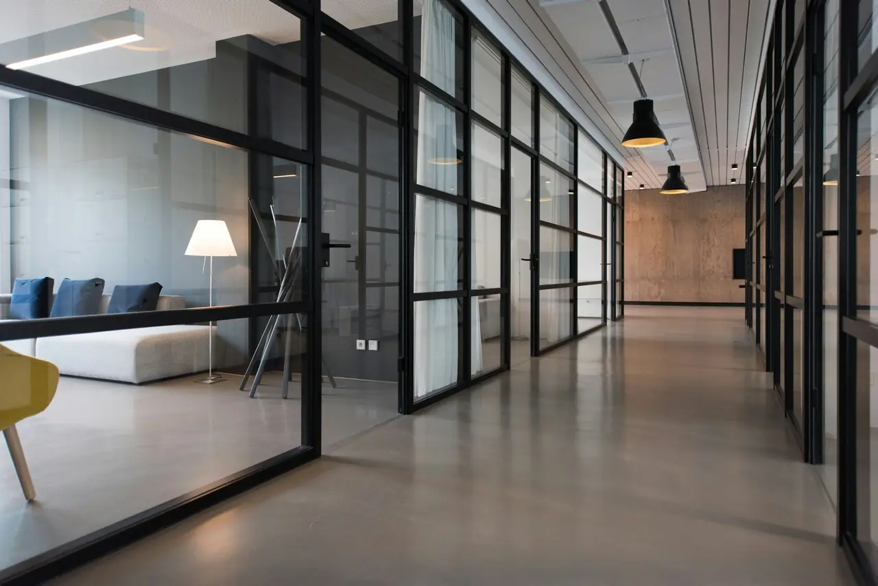 Premium office interior with custom wood wall panels, built-ins and custom furniture.